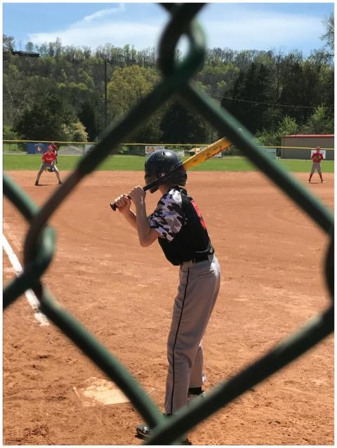 A young athlete ready to hit during a baseball gam