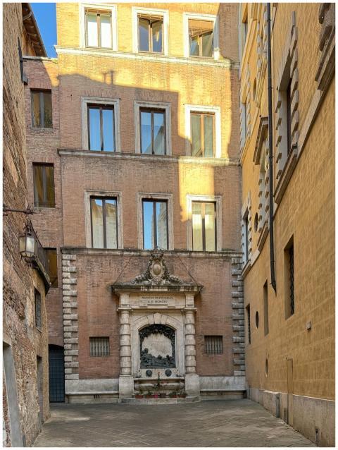 Charming alley with a historic fountain in Rome, I