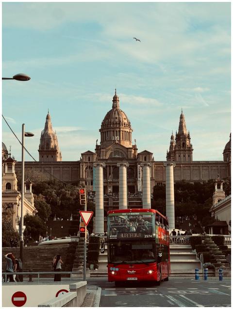 Red tour bus in front of National Art Museum of Ca