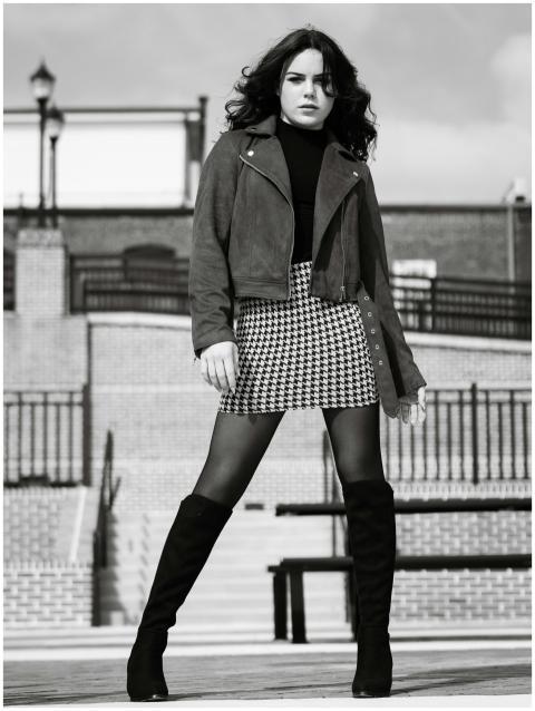 Stylish urban fashion portrait of a young woman in