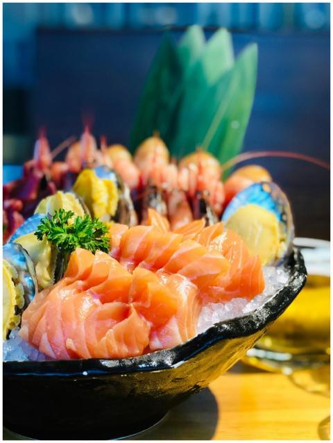 Close-up of a traditional sashimi platter showcasi
