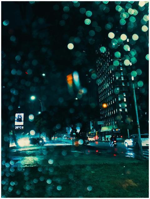 Dynamic urban night scene with illuminated skyscra