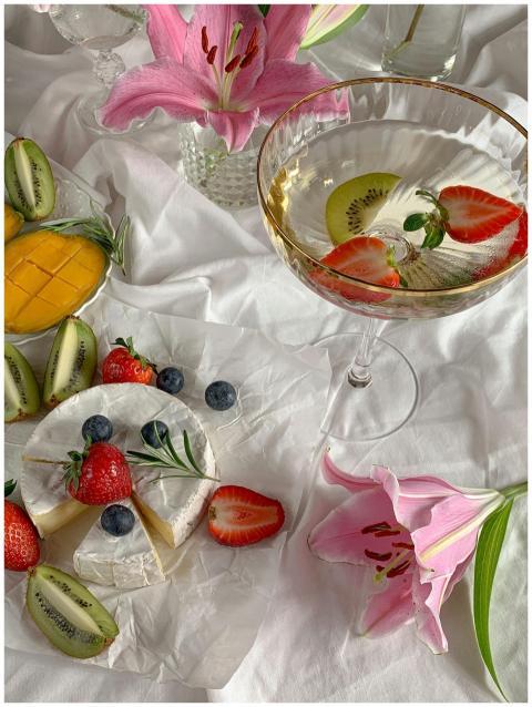 Cheese and fruit platter with wine, beautifully ar