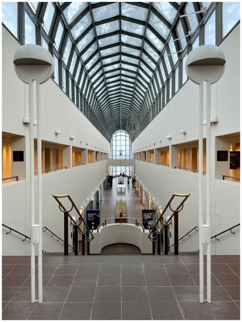 A stunning architectural atrium with a glass ceili