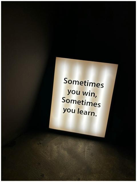 A light box in a dark room displays the motivation