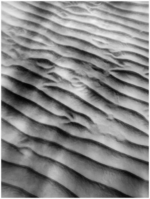 Monochrome image capturing the textured dunes in a