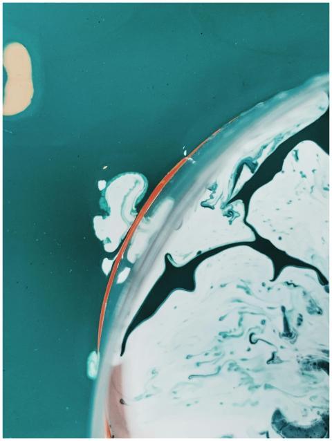 Drone view of turquoise sea water with barrier sep