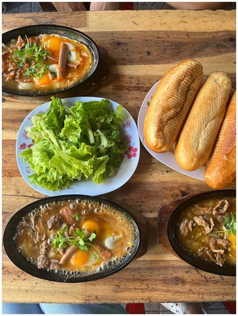 Delicious Vietnamese breakfast with banh mi, sizzl