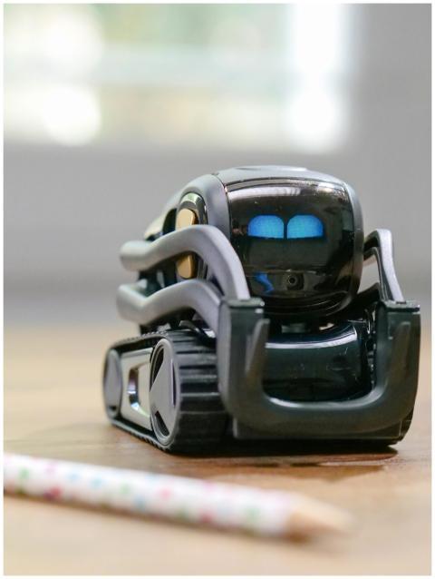 Explore the futuristic design of a miniature AI-po