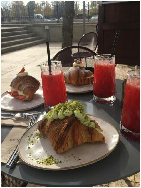 Delicious croissants and red juice served at an ou