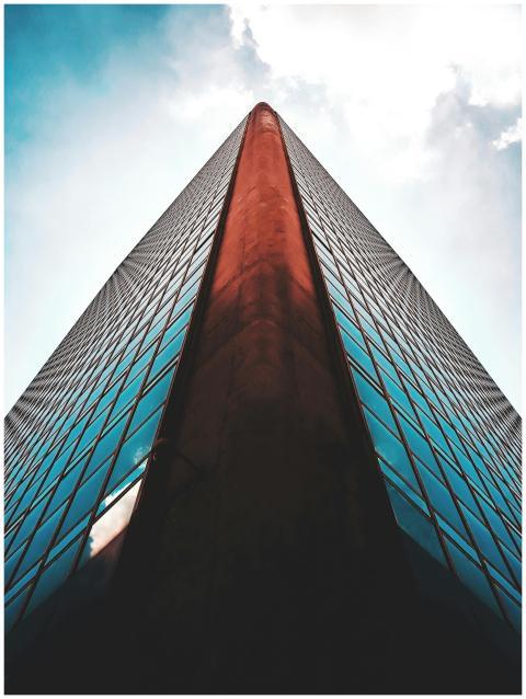 Striking low angle view of a modern skyscraper wit