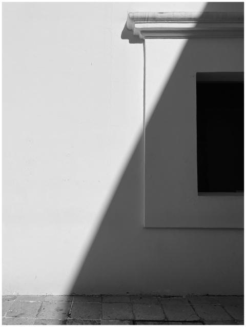 Black and white minimalist photo of a building fac