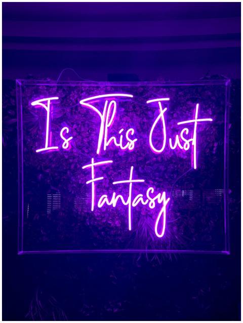 Purple neon sign with the text 'Is This Just Fanta