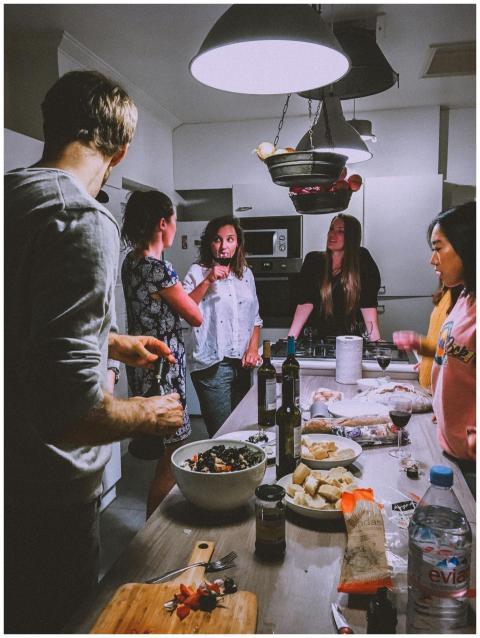 A group of adults enjoying a casual dinner party i