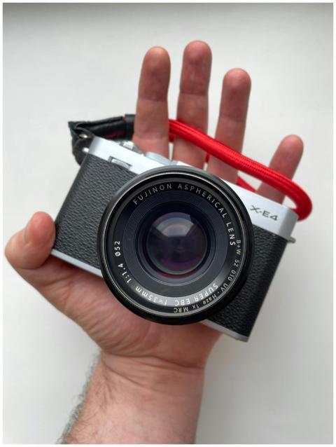 Close-up of a vintage-style camera with a Fujifilm