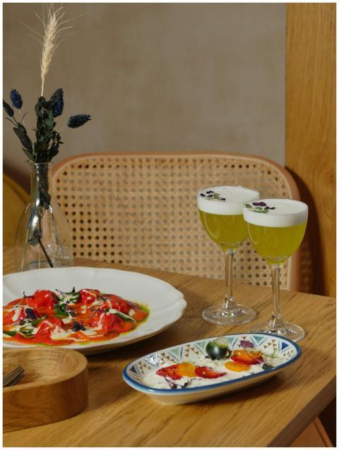 Vibrant drinks and dishes on a wooden table, perfe