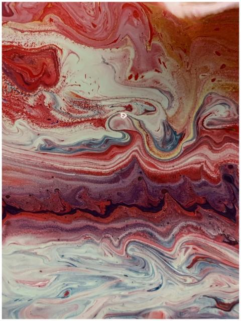 Colorful abstract swirling paint texture with dyna