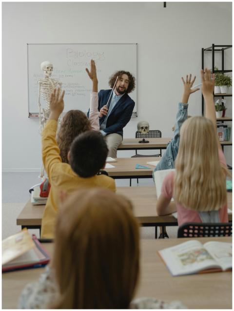 A classroom with a teacher and students actively p
