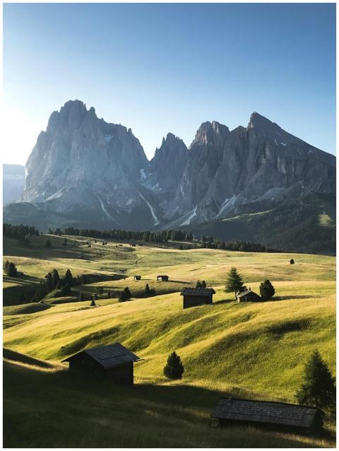 Stunning view of rolling hills and majestic peaks