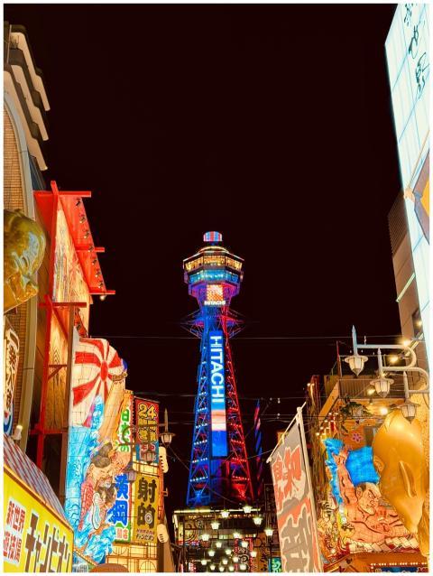 Colorful night view of Tsutenkaku Tower in Osaka,