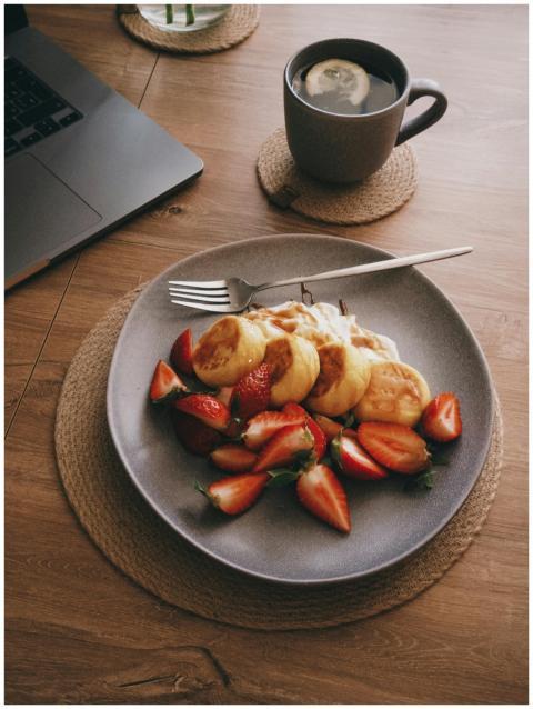 A tempting breakfast spread with pancakes, strawbe