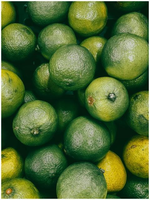 A vibrant close-up of fresh green limes, ideal for