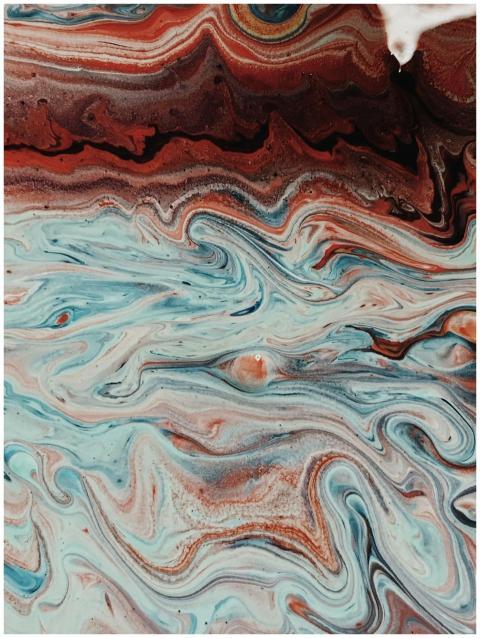 Abstract fluid artwork with vibrant blue and earth