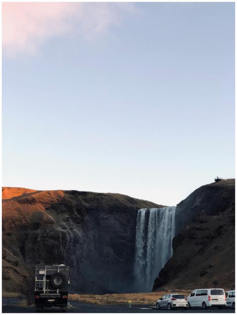 A stunning view of Skógafoss waterfall surrounded