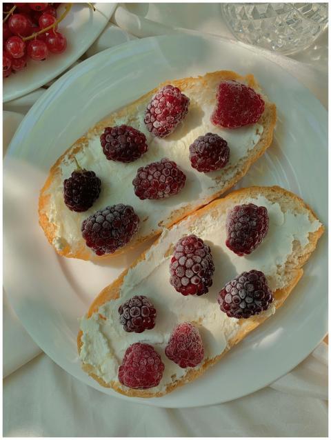 Close-up of raspberry toasts with cream cheese cre