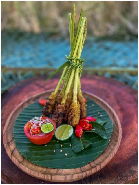 Delicious Balinese satay on banana leaves with fre