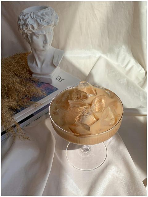 A stylish iced coffee served in a glass, set again