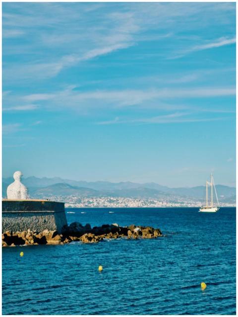 Explore the scenic Antibes harbor with a majestic