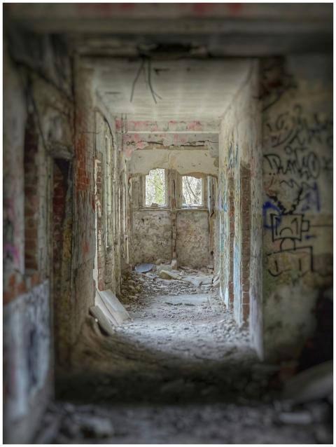 Explore the crumbling corridor of an abandoned gra