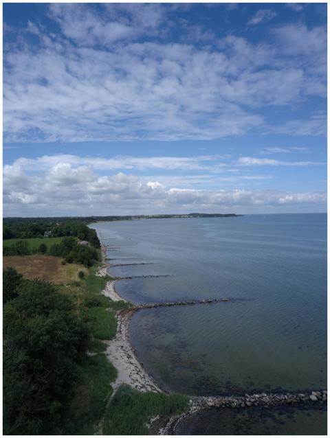 Aerial photo of the Danish coastline with lush gre