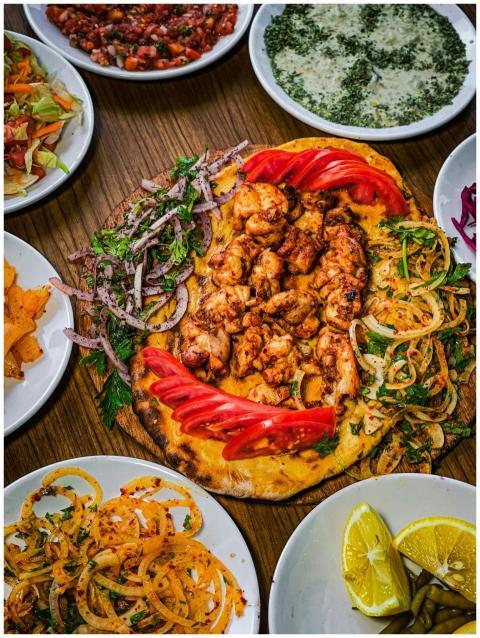 Flatlay of assorted Middle Eastern dishes featurin