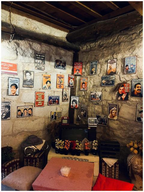 Cozy stone room decorated with vintage retro poste