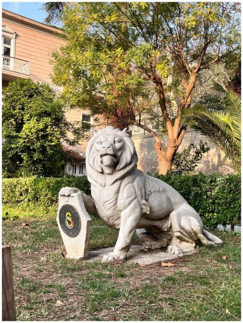 Statue Lion Lush Garden