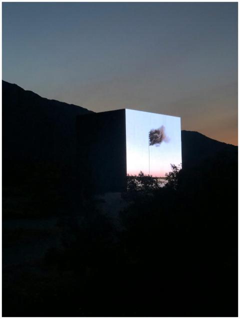 A striking evening view of a cube installation in