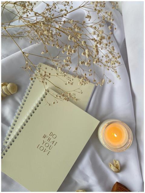 Top view composition of white spiral copybooks wit