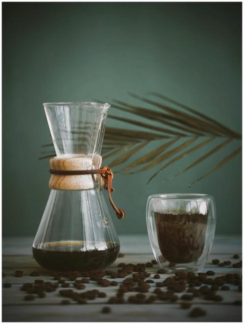 A minimalist coffee setup featuring a Chemex and g