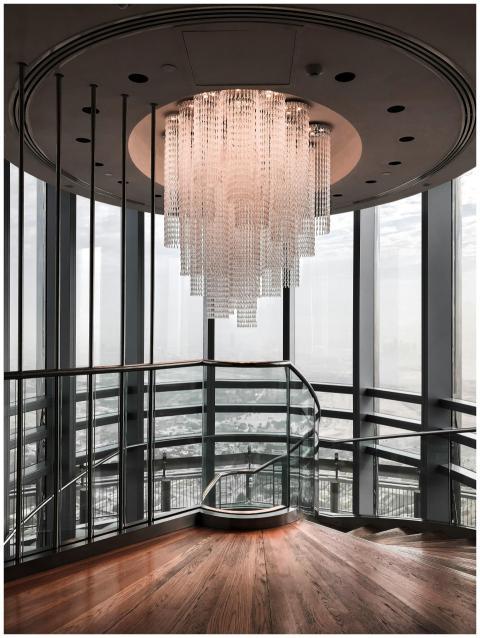 Elegant modern staircase interior featuring a larg