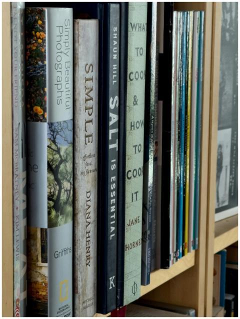 A close-up view of assorted book spines on a neatl