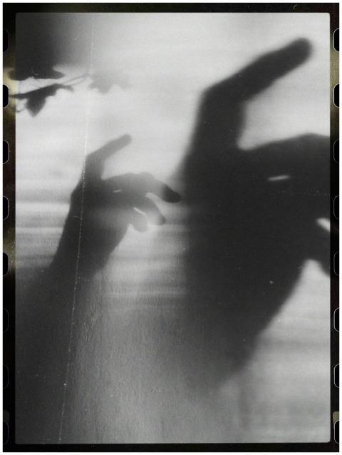 Black and white shadow play with hands creating ab