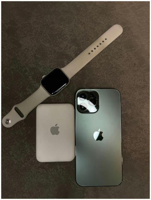 Flat lay of smartwatch, smartphone, and wireless c