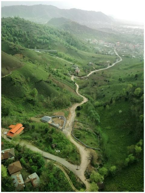 Scenic aerial view of winding roads and lush green