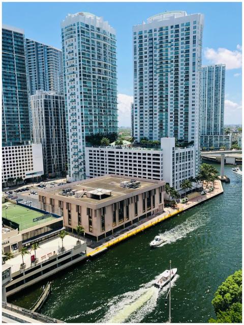 Aerial view of modern skyscrapers by a lively wate