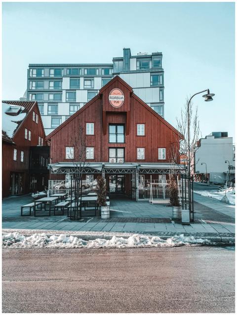 A city street showcasing mixed architecture styles