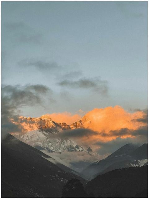 Stunning view of glowing mountain peaks at sunset
