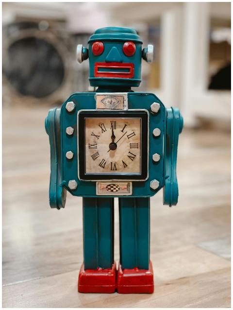 Vintage robot-shaped clock with roman numerals on