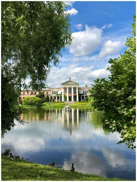 Serene view of a neoclassical building reflected i